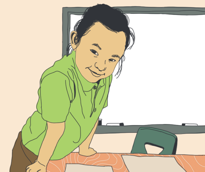 Young Asian student leaning over desk smiling